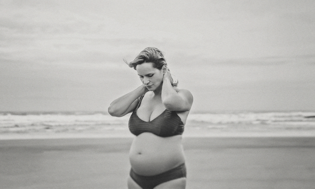 Image of a pregnant woman on a beach